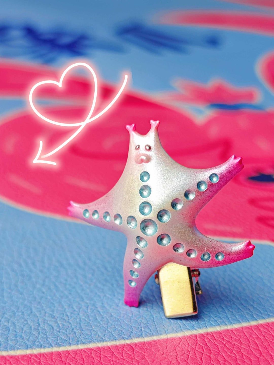 SeaStar cat hairclip in pearl and pink colors with playful design and titanium steel clip.
