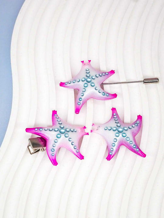 SeaStar cat hairclip and brooch in magenta and navy with pearl color blocking.