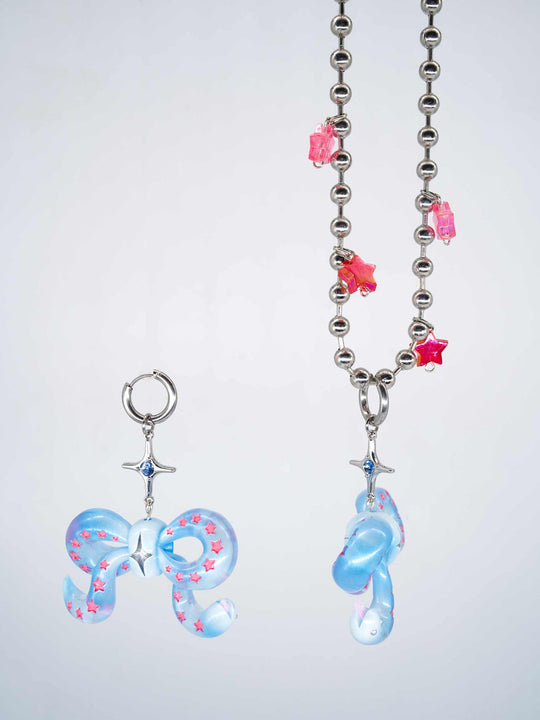 Ice blue snake bowtie necklace and earring with pink star accents and ball chain necklace