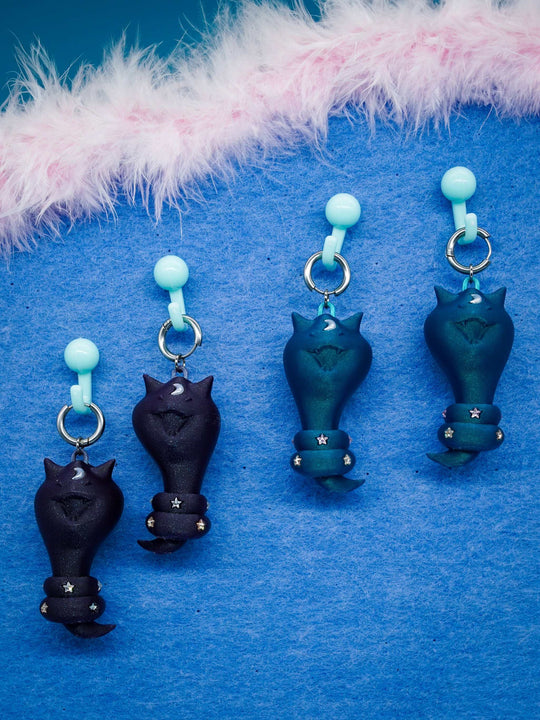 Cat Snake jewelry set with diamond star accents including necklace, earring, and bag charm