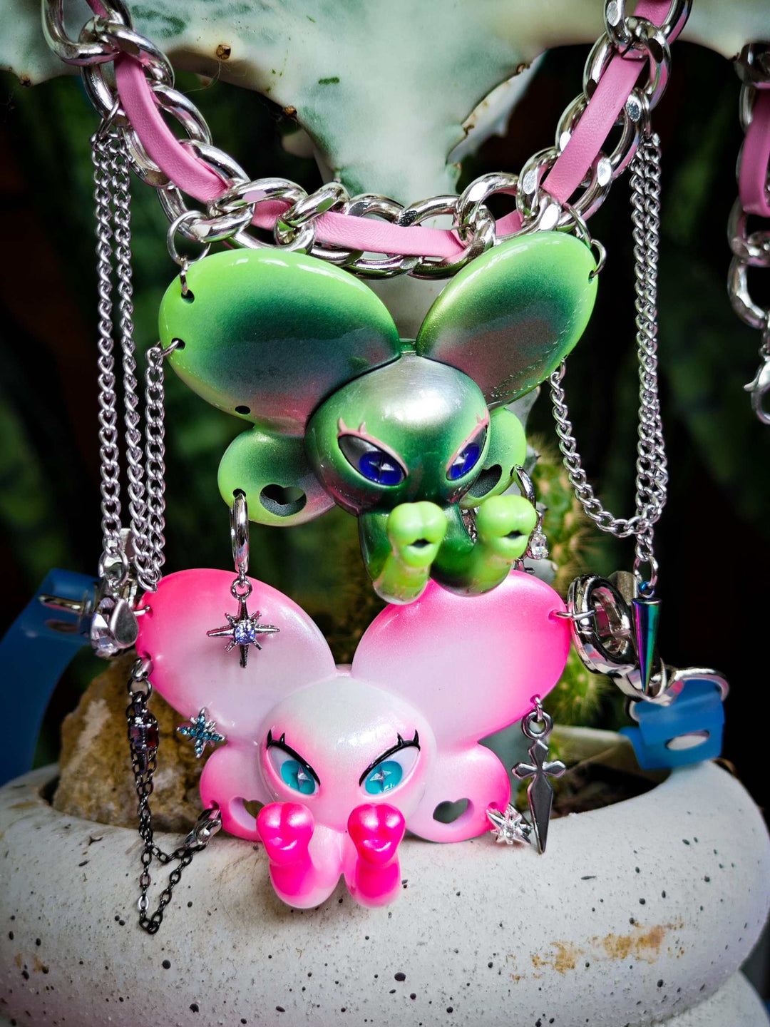 Twin-Trunk Diva Elephant Necklace in pink pearl white with two trunks and blue-green star pupils