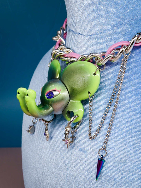 Twin-Trunk Diva Elephant Necklace in metallic alien apple green with two trunks and starry eyes