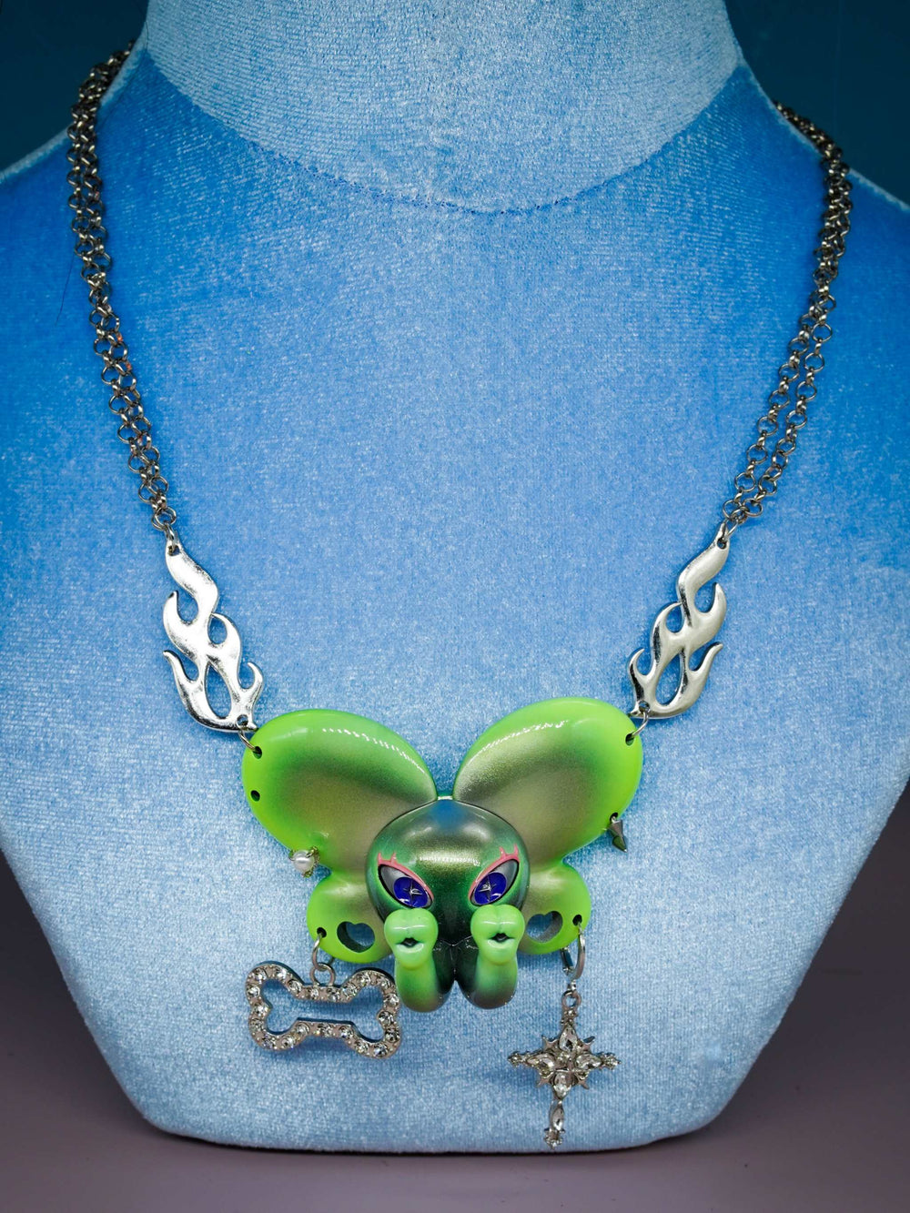 Twin-Trunk Diva Elephant Necklace in alien apple green with two trunks and metallic sheen