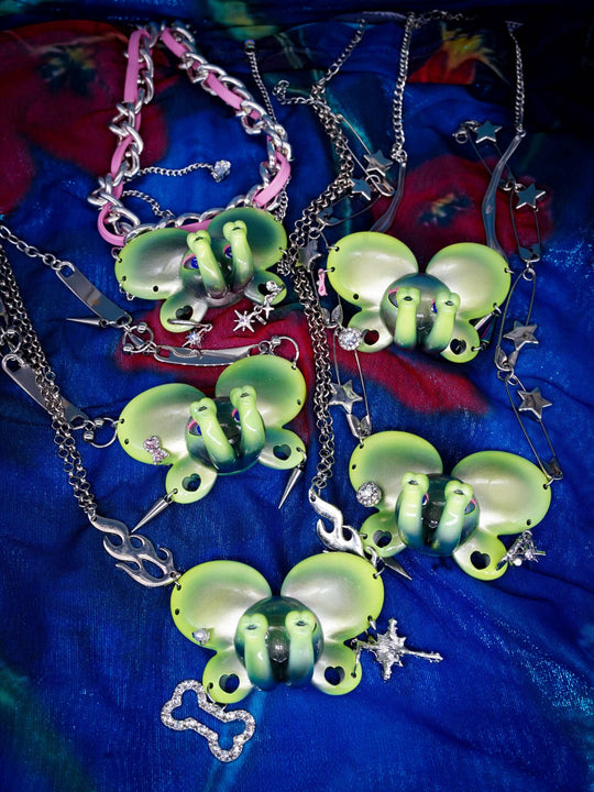 Twin-Trunk Diva Elephant Necklace in alien apple green with two trunks and starry eyes