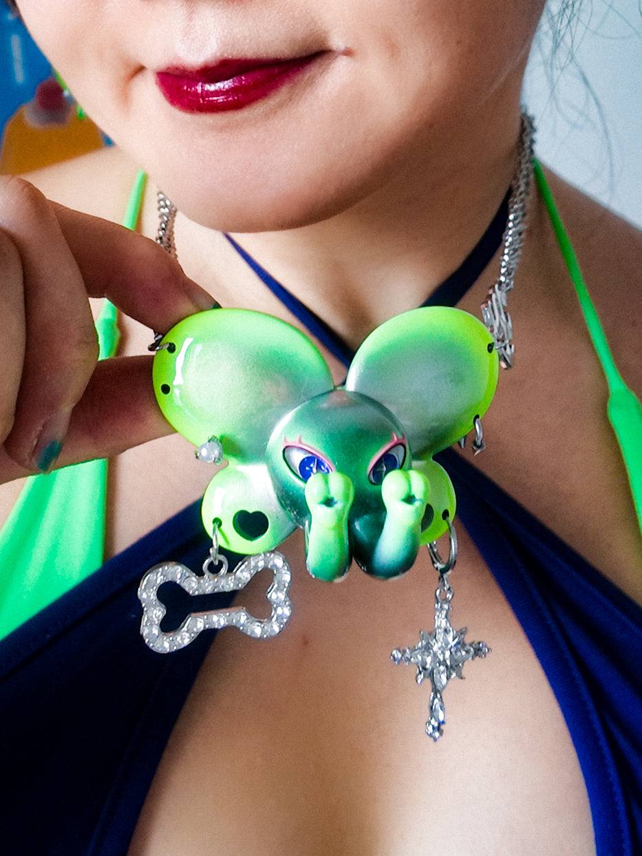 Twin-Trunk Diva Elephant Necklace in metallic alien apple green with two trunks and starry eyes