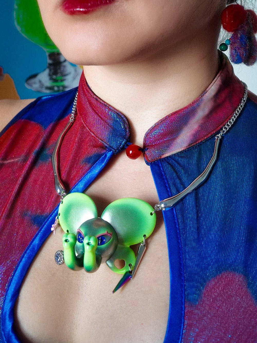 Twin-Trunk Diva Elephant Necklace in alien apple green with two trunks and metallic finish