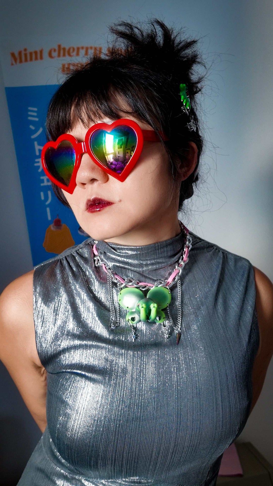 Twin-Trunk Diva Elephant Necklace in alien apple green with two trunks, metallic finish, and starry eyes