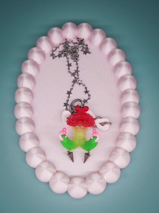 Twin-headed pitcher serpent earrings in translucent cherry red, acid green, and bubblegum pink with metal spikes by Acid Candy
