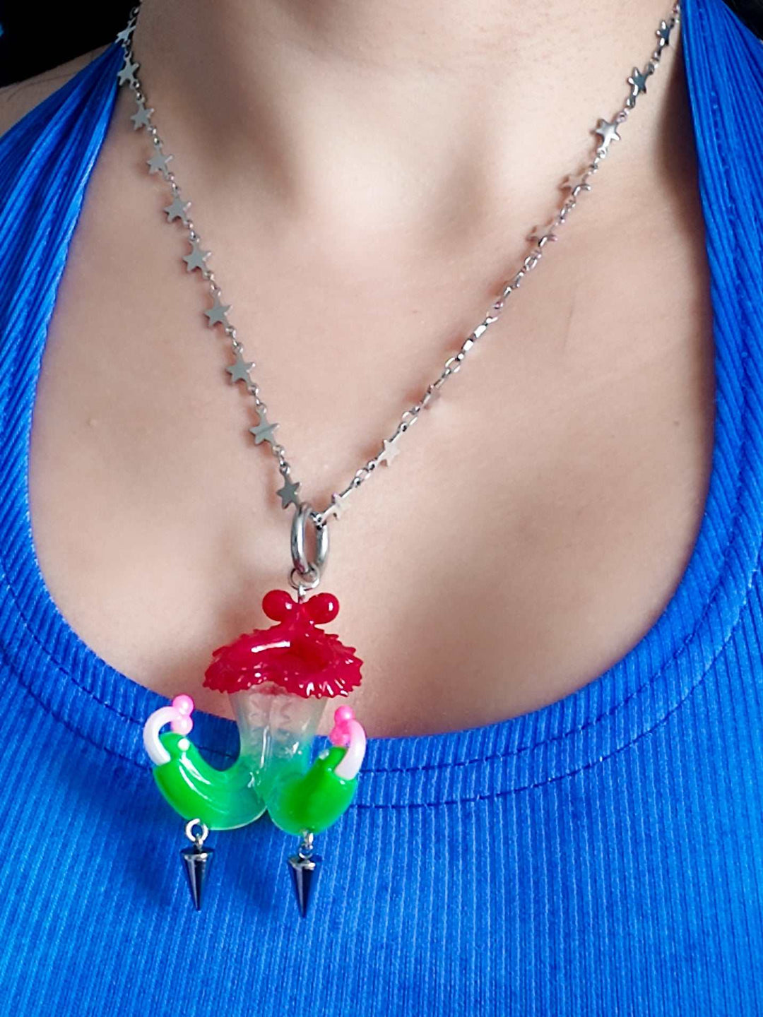 Twin-headed pitcher serpent earrings in cherry red, acid green, and bubblegum pink with metal spikes by Acid Candy