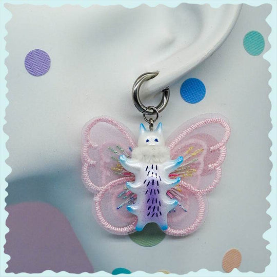 Butterfly cat earring with pearlescent colors and embroidered wings.