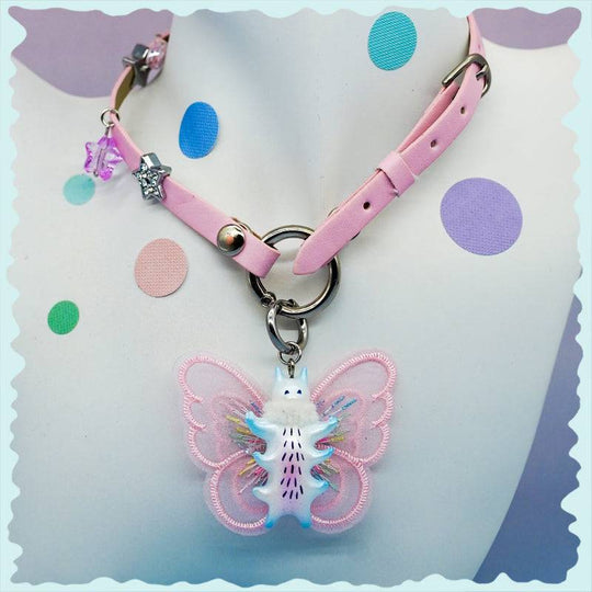 Butterfly cat necklace with pearl white snood and earring, featuring colorful accents.