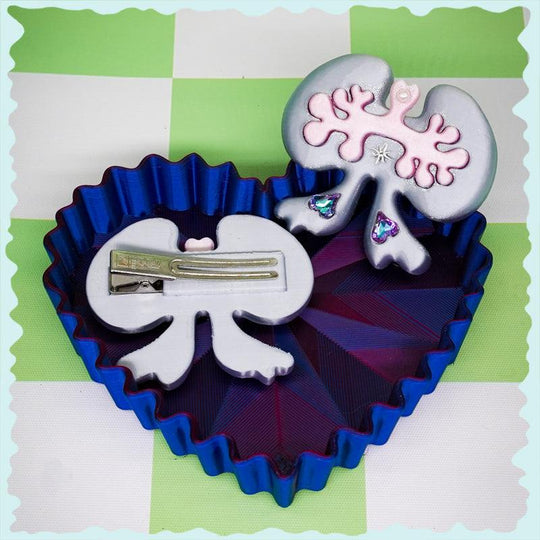 Weird cute lung-shaped bow hair clip in white and green, 3D printed organ-inspired accessory with rhinestone details