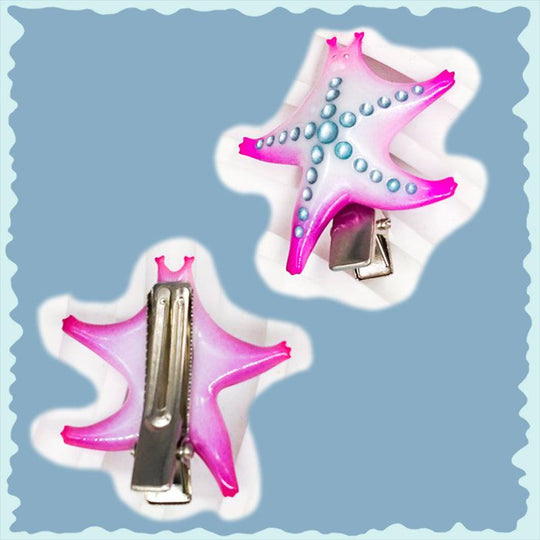 SeaStar cat hairclip in magenta and navy with pearl color blocking.