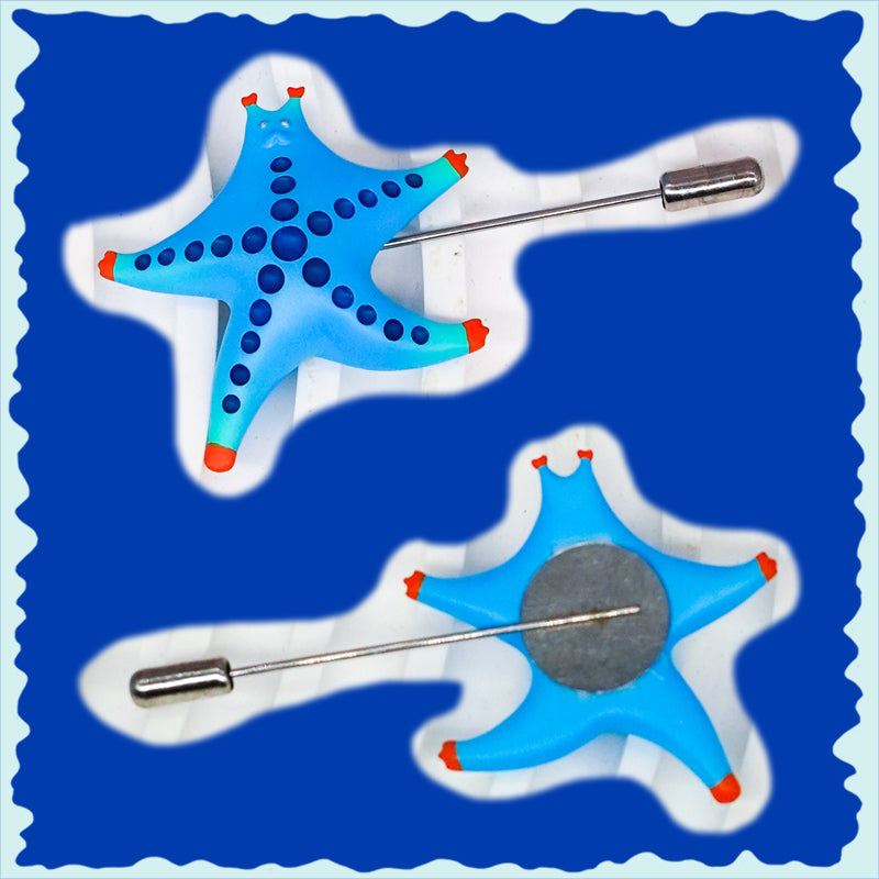 Alluring magenta and navy SeaStar cat hairclip and brooch, vibrant and whimsical design.