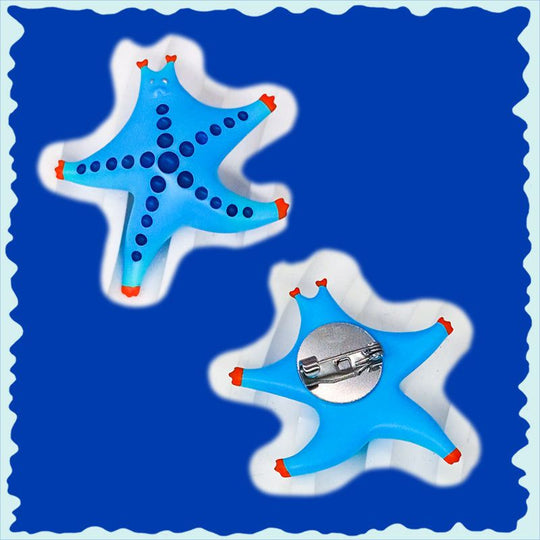 SeaStar cat hairclip and brooch in magenta and navy, featuring cat-shaped design with polyurethane resins and titanium steel.