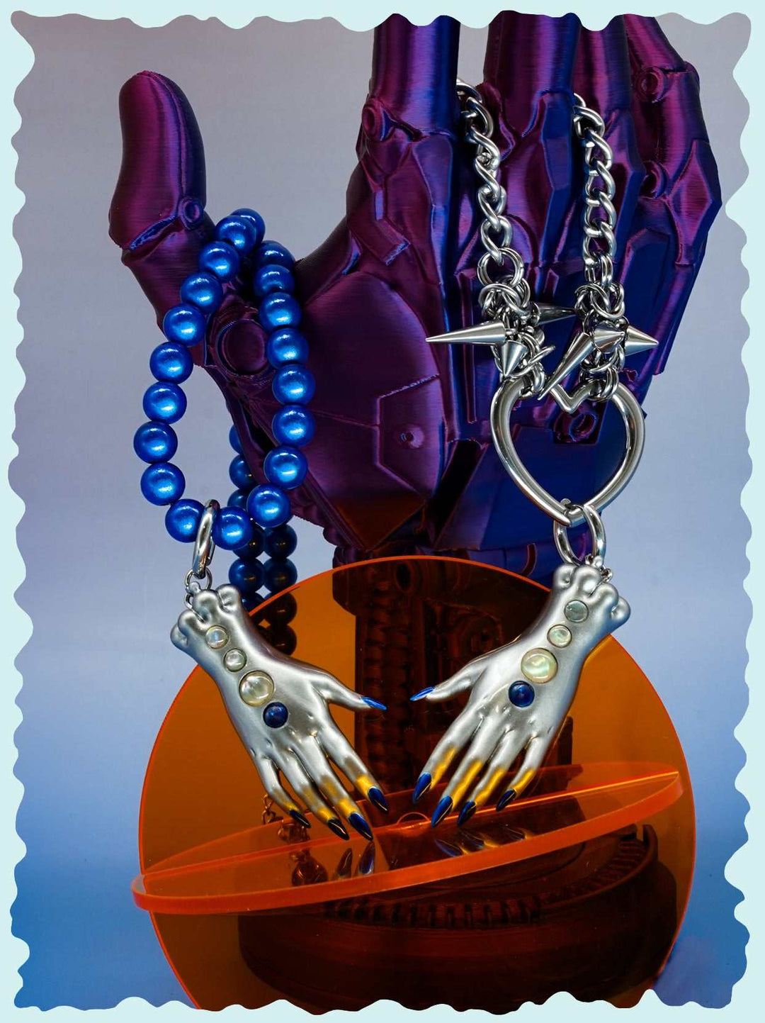 Moonlight Silver Fairy Goblin Hands necklace and earrings with metallic silver finish, blue gradient nails, and tiny gems.