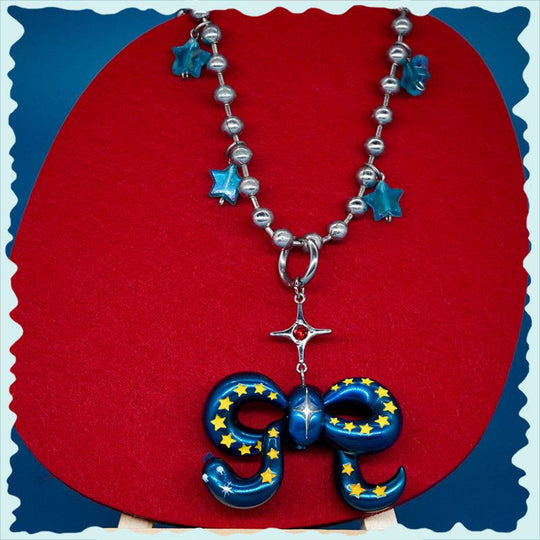 Blue metal Snake Bowtie necklace and earrings with felt tongue detail, starry unique accessory