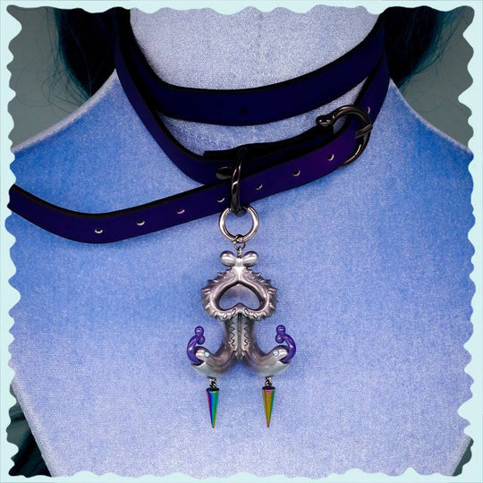 Twin-headed pitcher serpent earrings with violet tendrils and silver metallic details