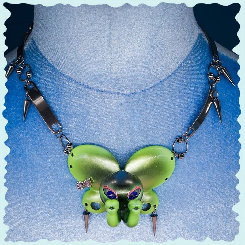 Twin-Trunk Diva Elephant Necklace in pink pearl white with two trunks and sparkling blue-green starry eyes
