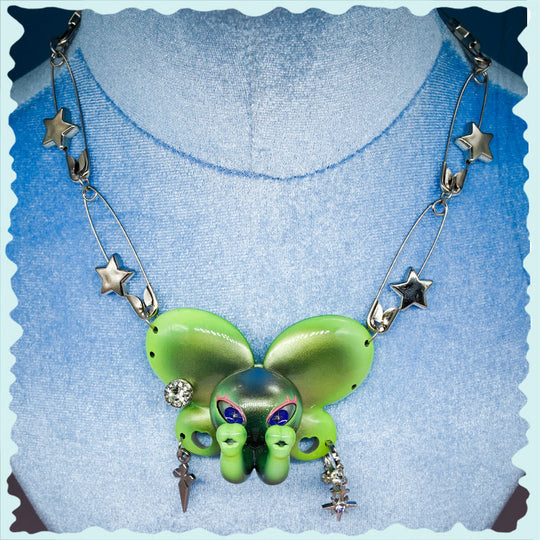 Twin-Trunk Diva Elephant Necklace in alien apple green with two trunks and starry eyes